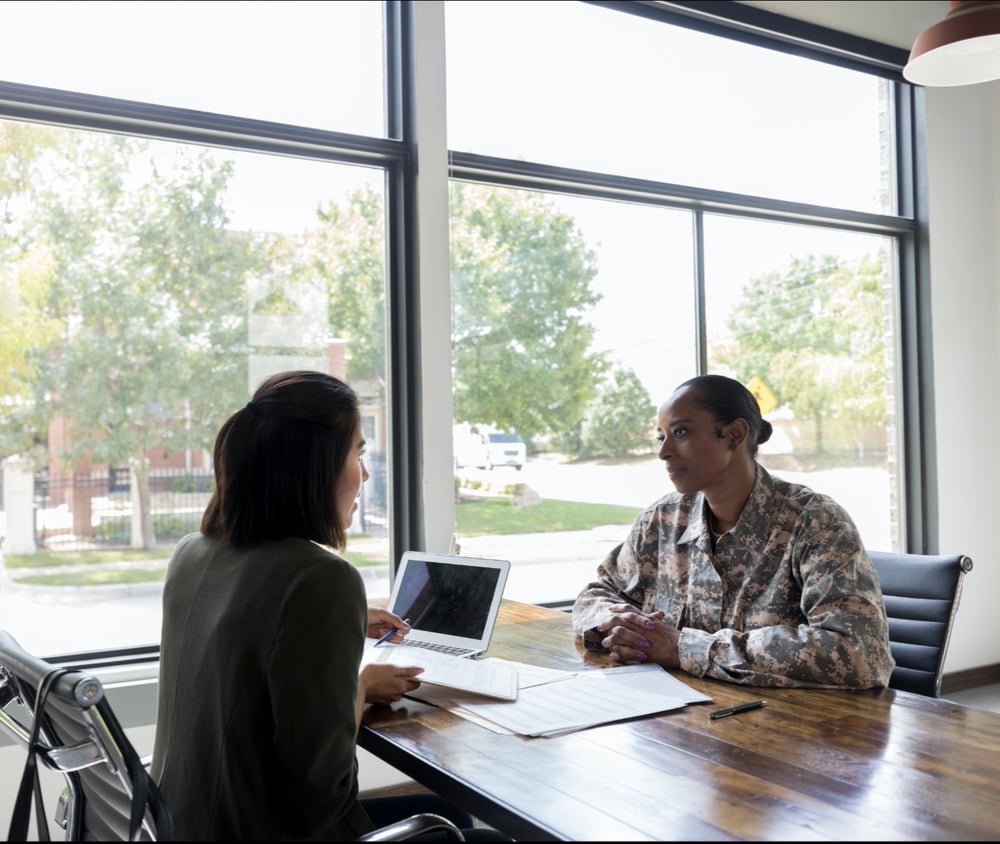 Work for Warriors Texas image of National Guard soldier getting help from an employment counselor.